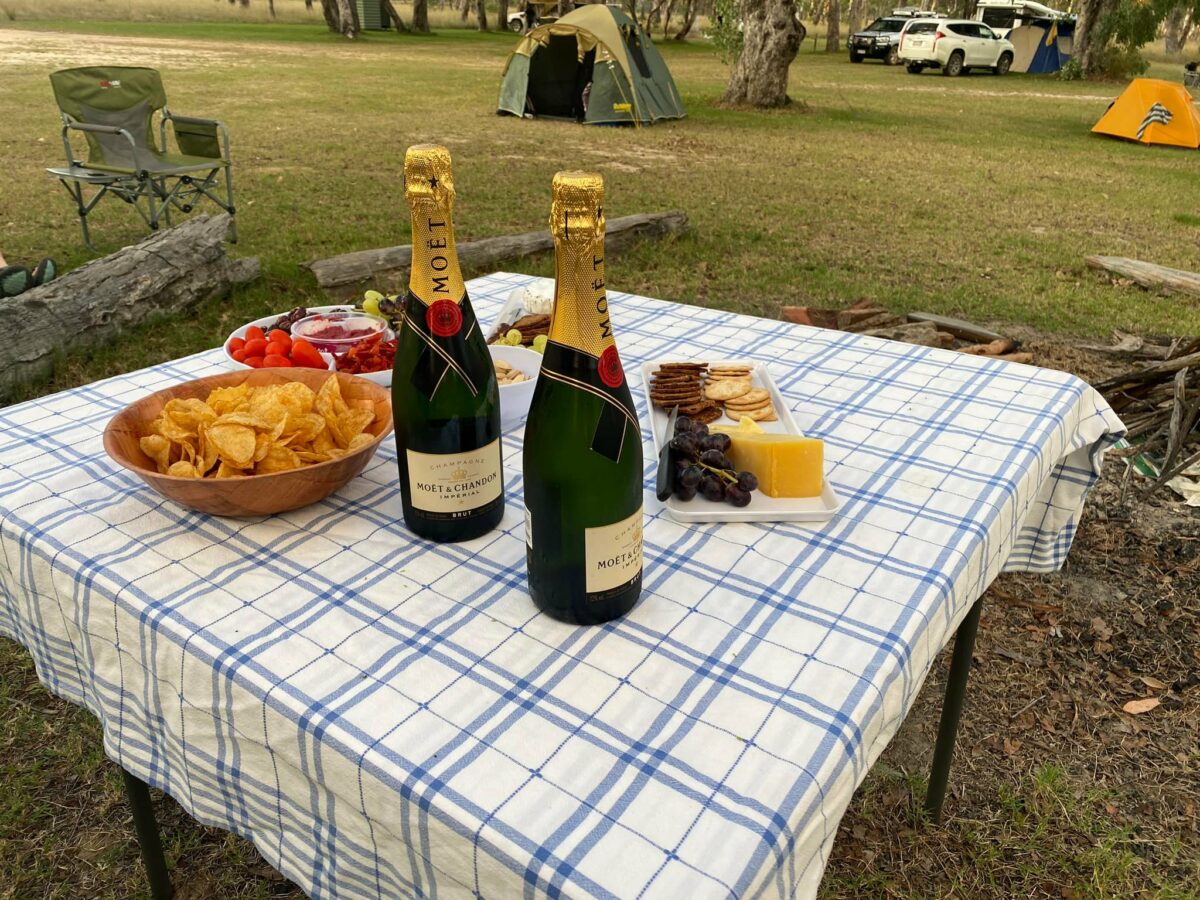 Drinks and snacks on a table outdoors