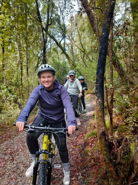 Georgie discovering the hiking trails on a bike with members of Women's Fitness Adventures