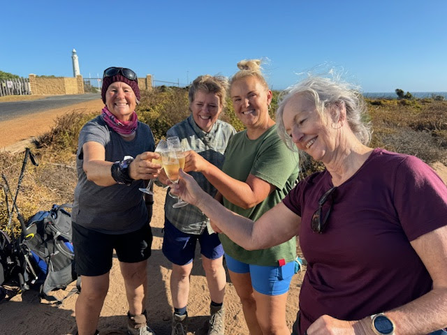 Georgie celebrating with her fellow Women's Fitness Adventures hikers at the end of the 100km Cape to Cape course 