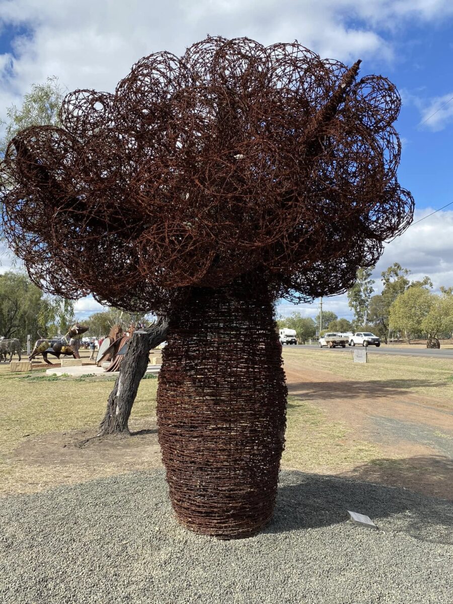 A sculpture tree in the foreground of the Roma tour in Outback Queensland