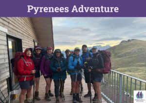Seven women from Women's Fitness Adventures and their guide hiking the Sentier de Camille in the Pyrenees.