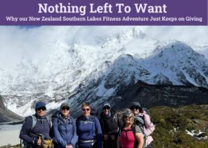Group of hikers posing in front of snowy mountain peaks in New Zealand