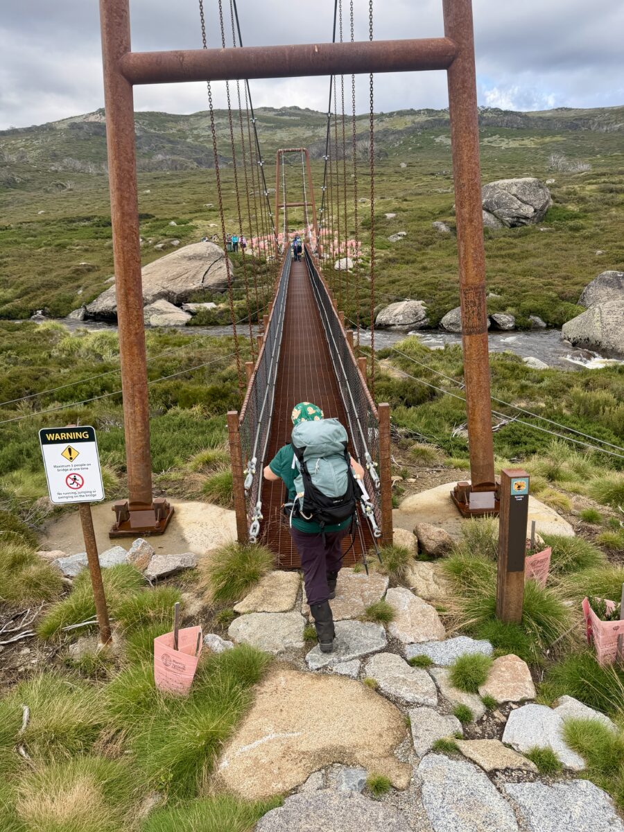 Women hiking on the Swing Bridge at Guthega in the Snowy mountains